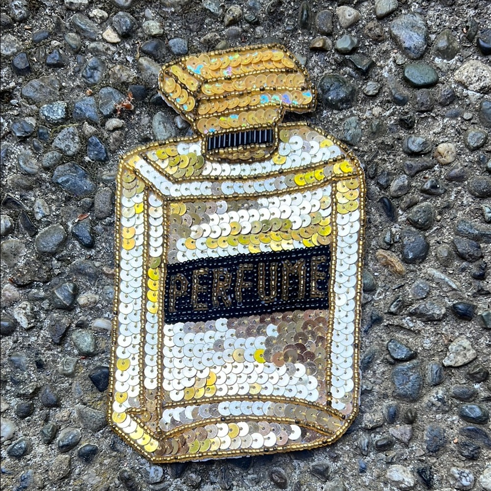 Sequin and Bead Sparkle Bottle Pin or Patch says “Perfume”